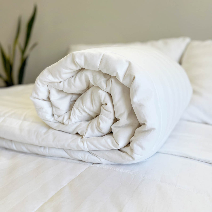 Rolled Mulberry silk duvet on a bed